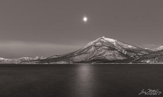 Moon setting behind Mt. Eniwa