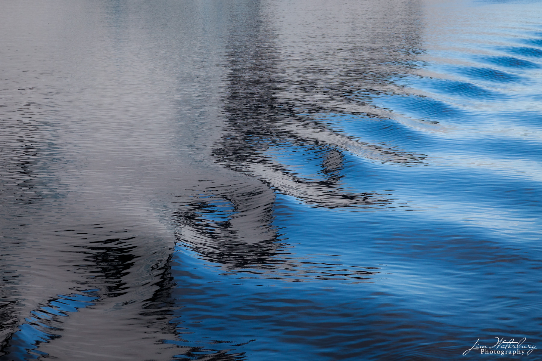 Ripples and reflections in water off the Antarctic Penninsula.