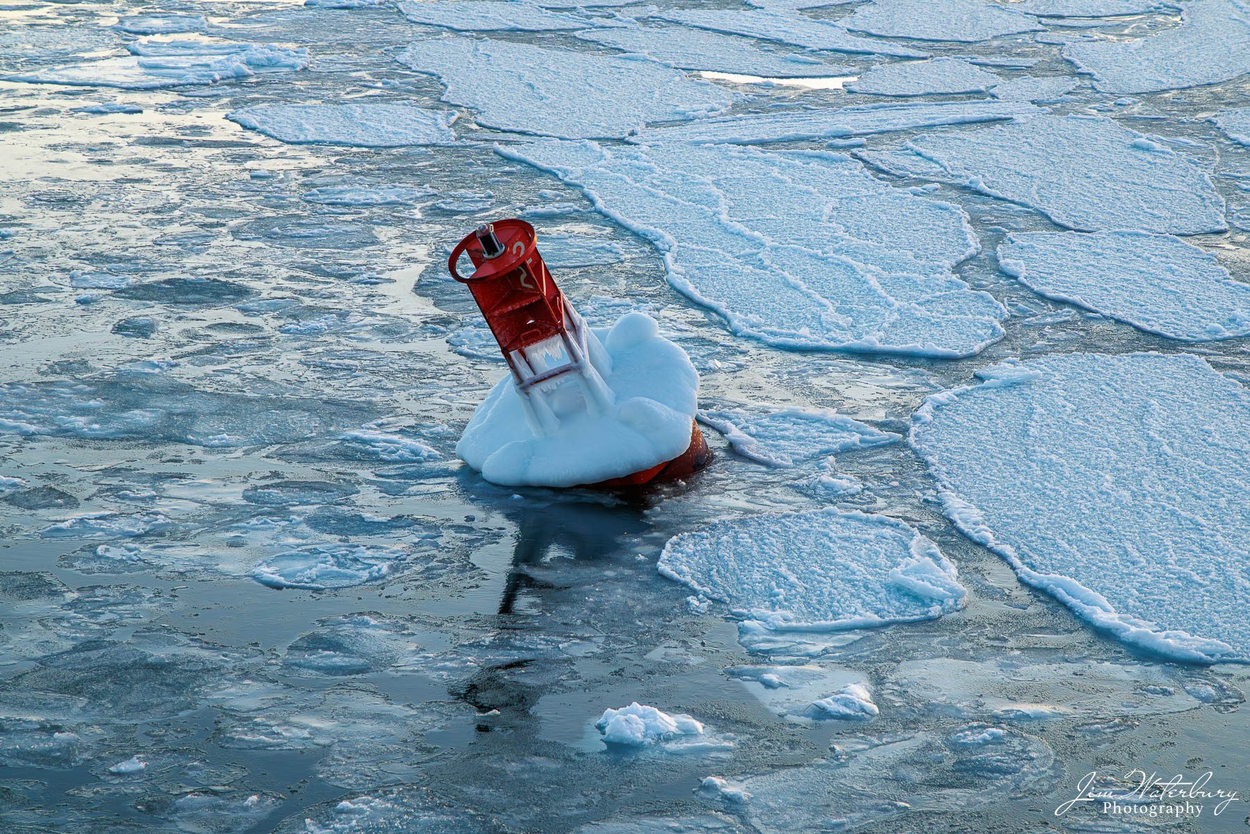 Channel buoy No. 2 Channel navigational buoy surrounded by ice at the entrance to Nantucket Harbor