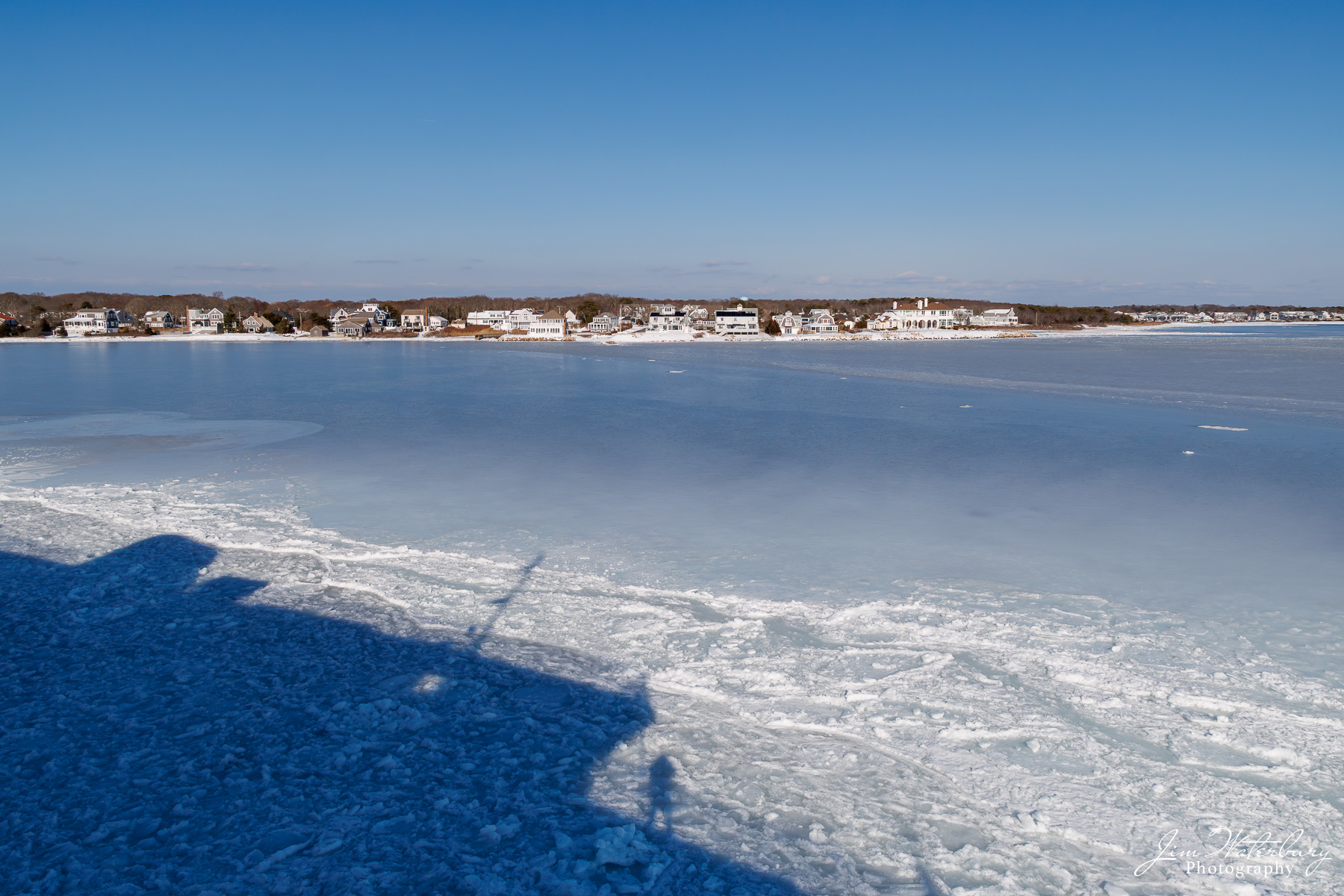 Ferry Home Steamship Authority "Eagle" cuts through the ice at the entrance to Hyannis Harbor, with the shadow of the ferry (and the photographer...