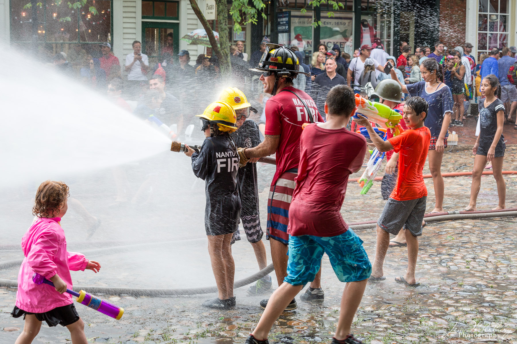 Water Fight Each July 4th, the town of Nantucket hosts a friendly water fight between the Nantucket Fire Department, and volunteer fire fighters...