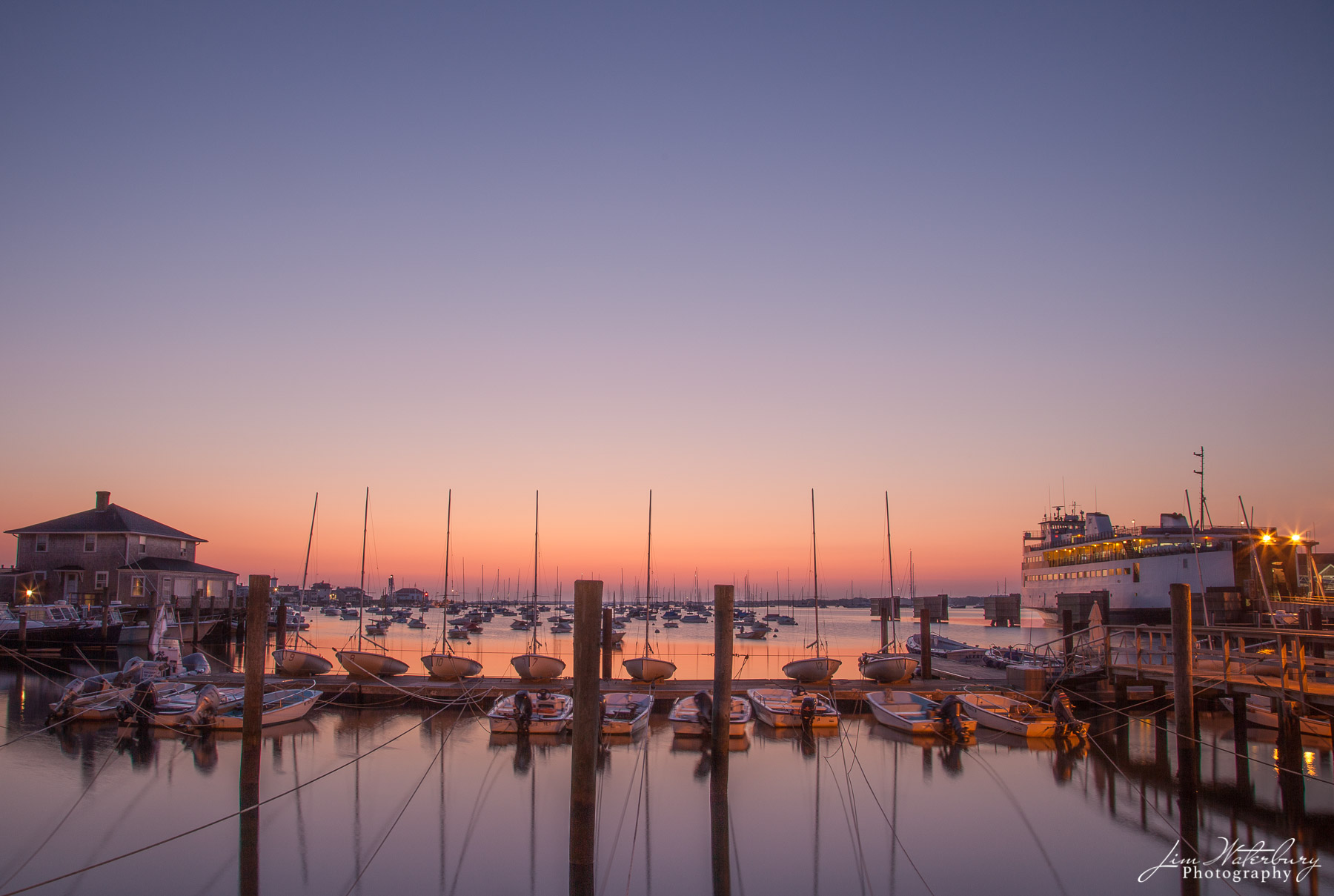 Ferry at Dawn Dawn as seen from the docks of the Nantucket Yacht Club, with the Steamship Authority's car ferry awaiting its first crossing...