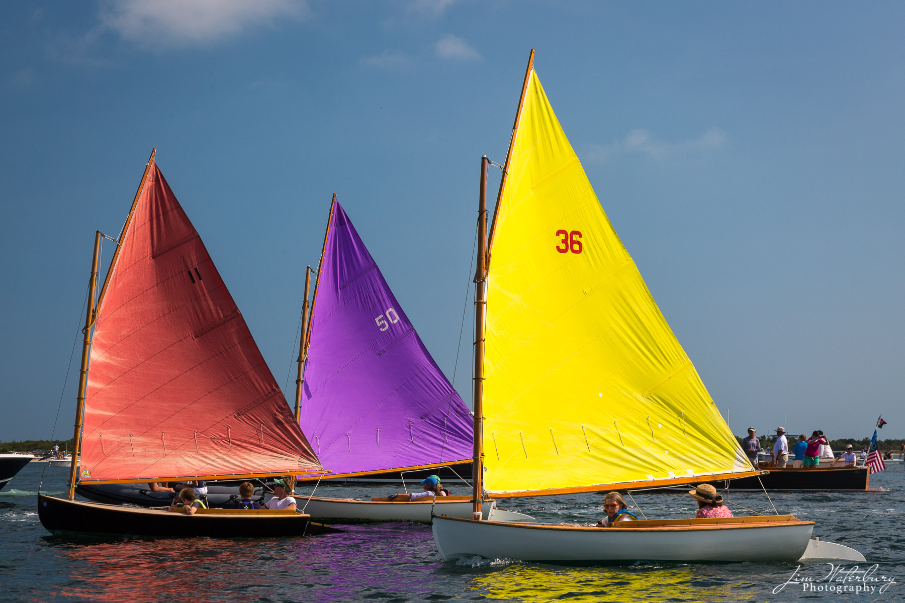 Sailing in Living Color Members of the Nantucket Rainbow fleet, with their colorful sails, kick off the final day of sailing at the annual Nantucket...