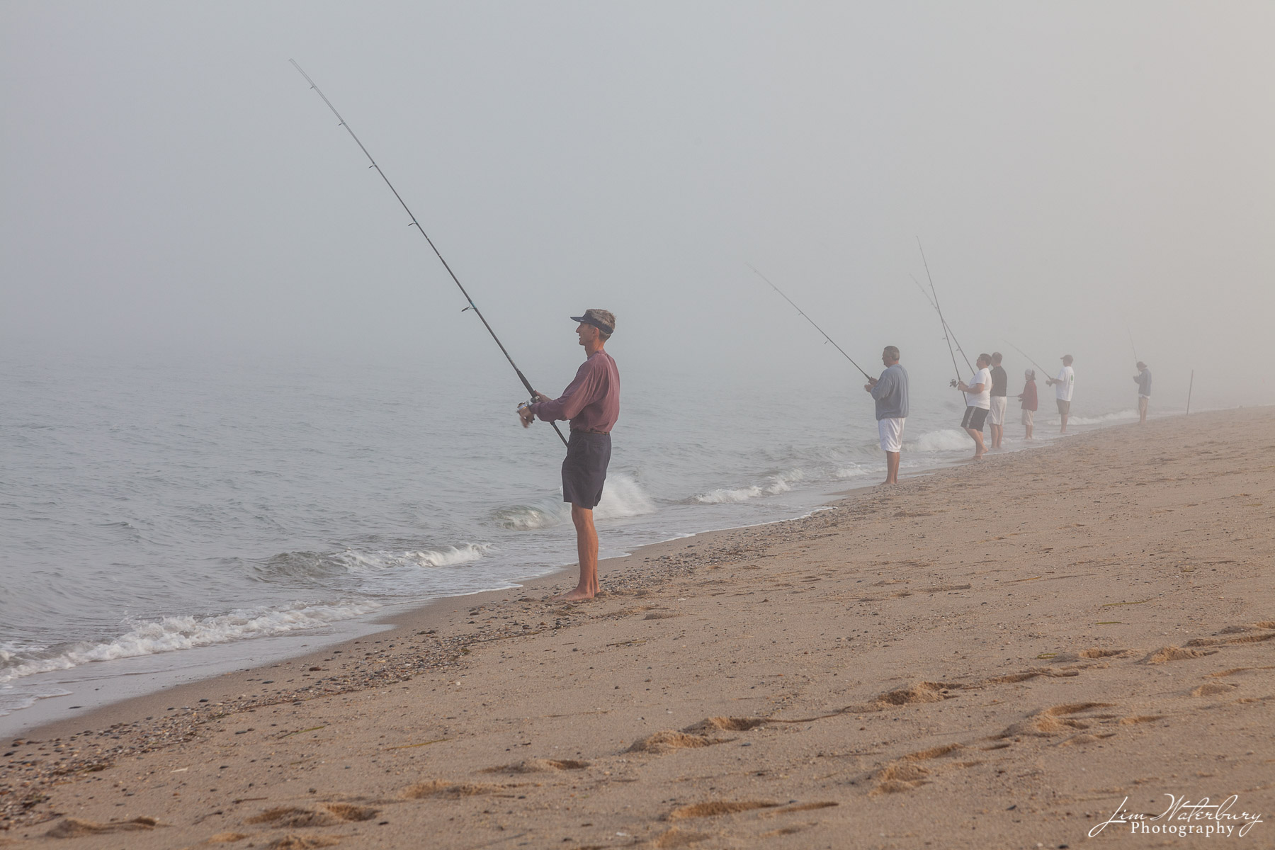 Just Fishin' Fishermen surfcasting off the beach on Nantucket in the early morning fog.