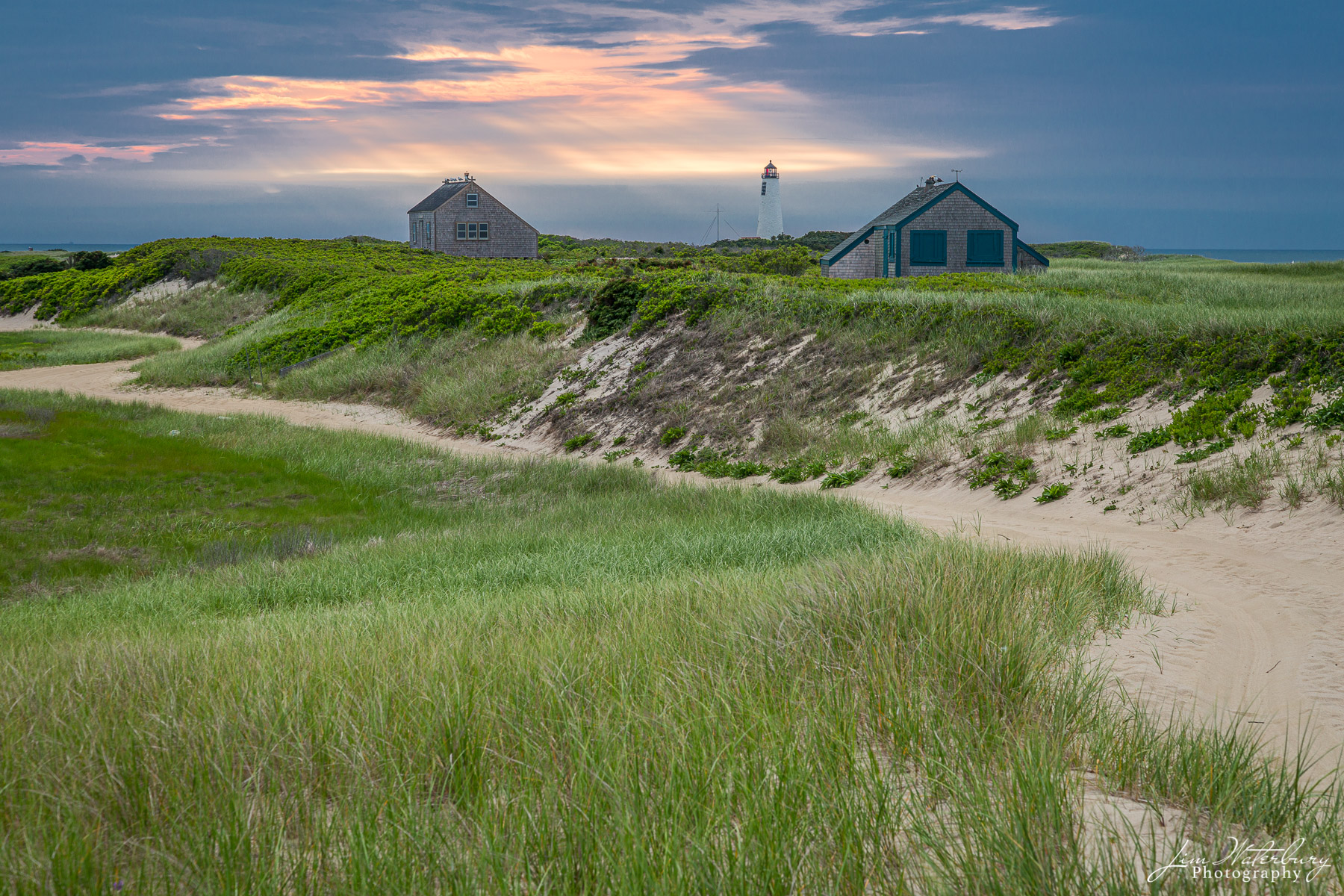 Great Point Great Point Lighthouse stands tall above the green grasses, shrubs, and sandy paths of Great Point, on Nantucket, MA. Great...