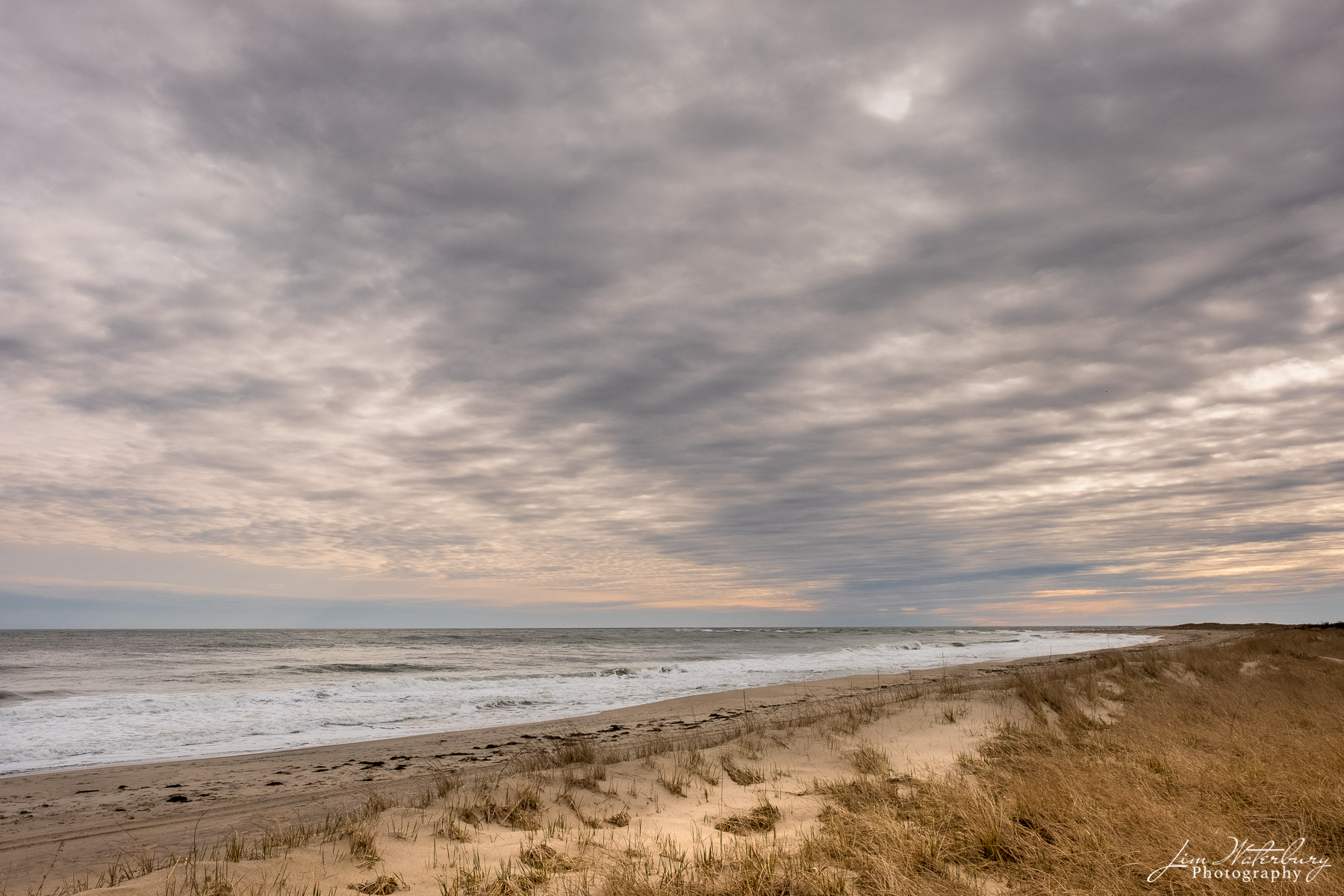 Moody The dunes, with a moody sky above and a calm ocean, present a typical spring scene on Nantucket's south shore.