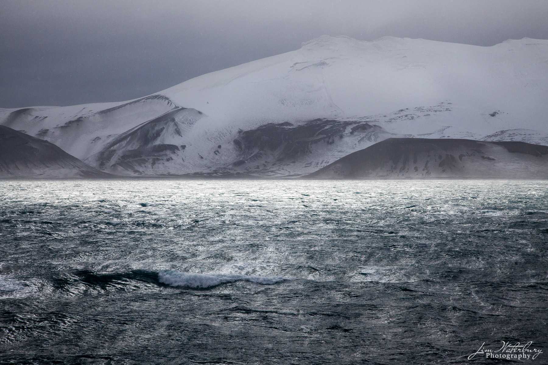 Stormy Seas Sunlight illuminates a stormy sea in the Antarctic peninsula around Deception Island. Deception Island is located in South Shetland...