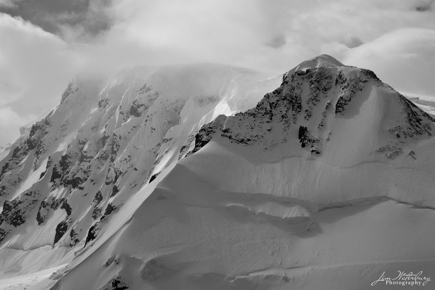 Cascading Peaks Black & white photograph of mountain peaks from Port Lockroy, Antarctica. The harbour at Port Lockroy was used for whaling during...