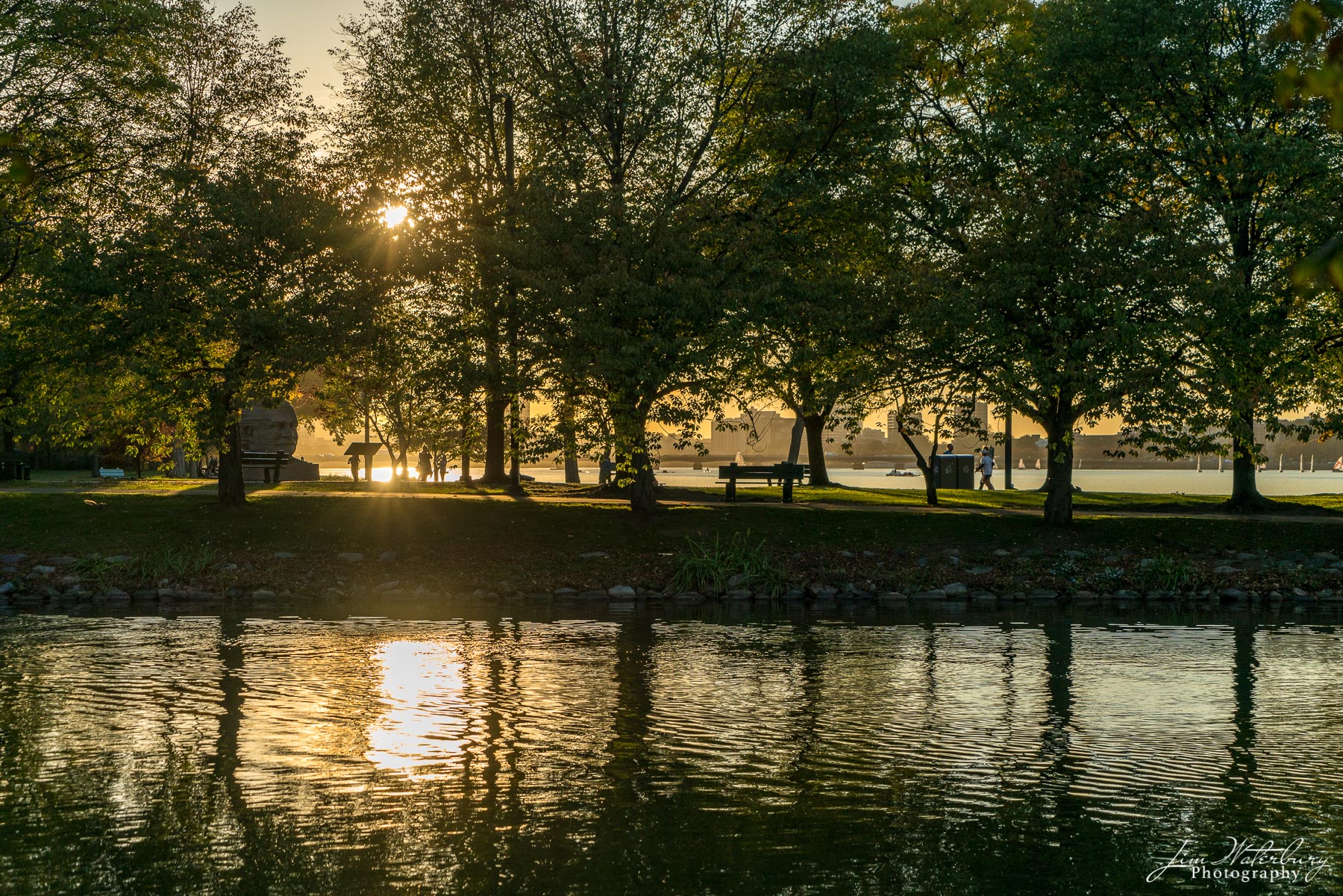 Boston Reflections The late afternoon sun shines its warm light across the waters of the Charles River in Boston.