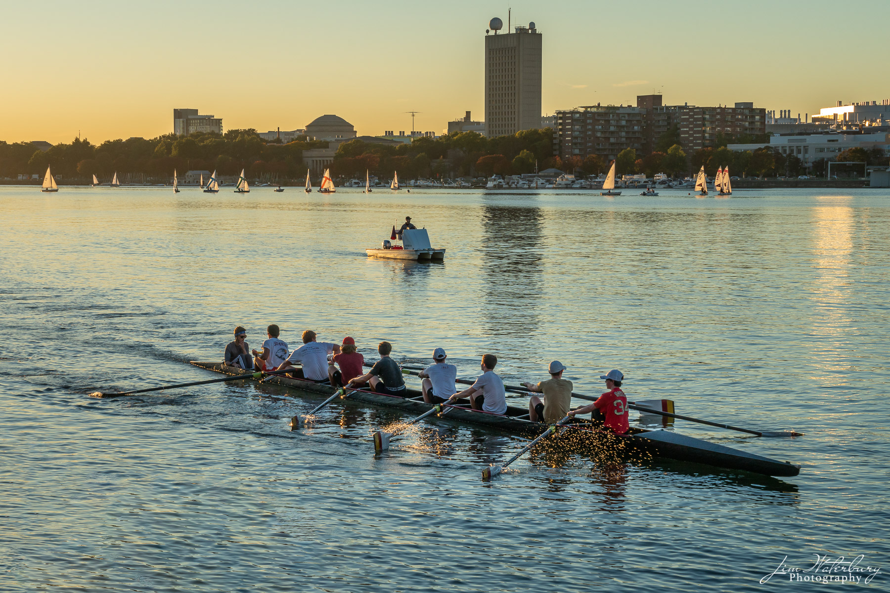 On the Waterfront Boats of various types and sizes practice in the late afternoon sunlight on the Charles River in Boston.