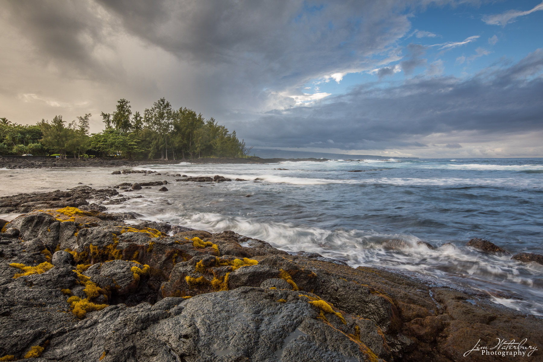 The Pacific Landscape of the rocky shore, surf, and breaking waves along the Big Island of Hawaii near Hilo.