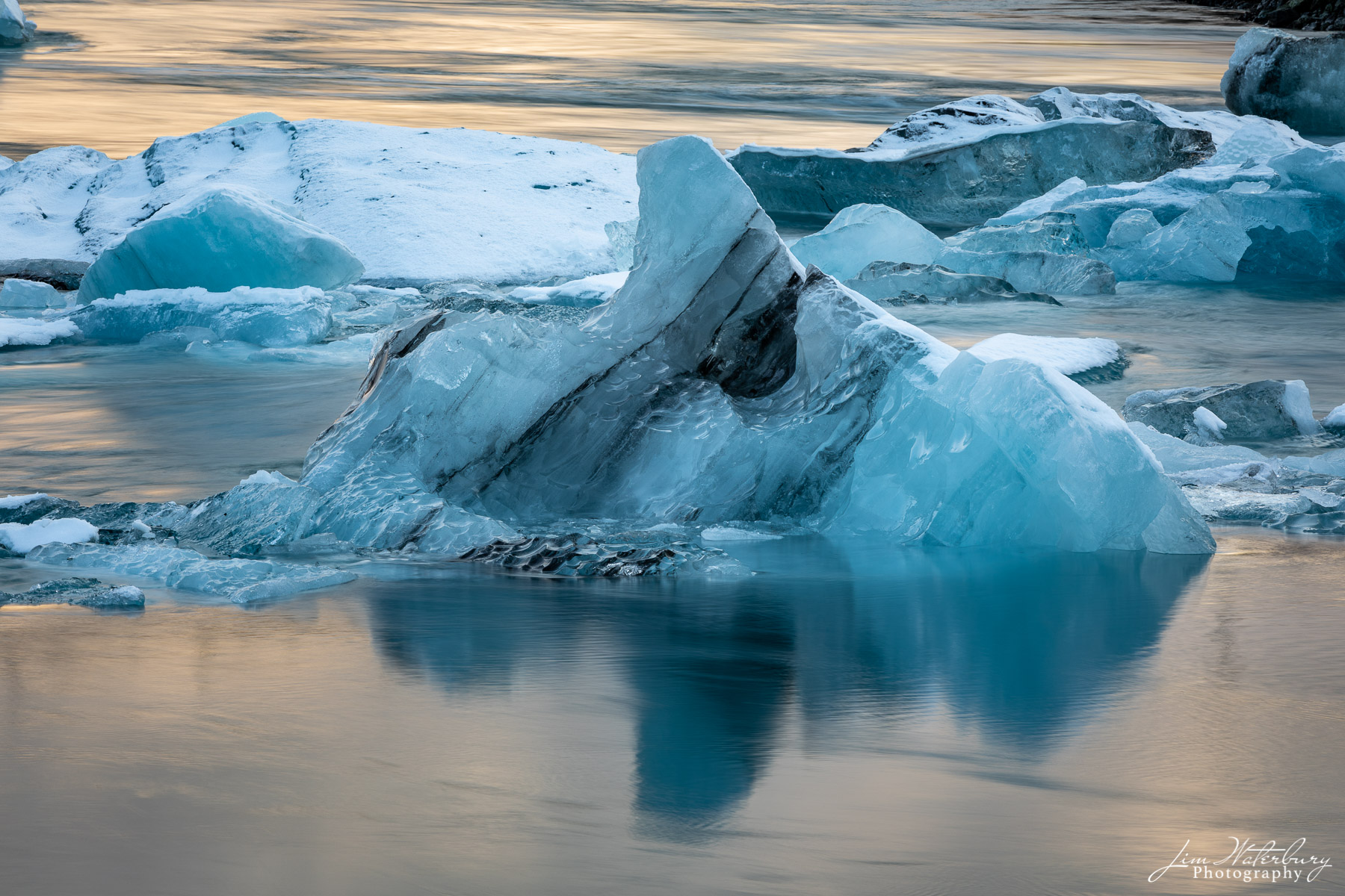 Icebergs, broken off from the main glacier, float in the Jokulsarlon glacial lagoon in Iceland.