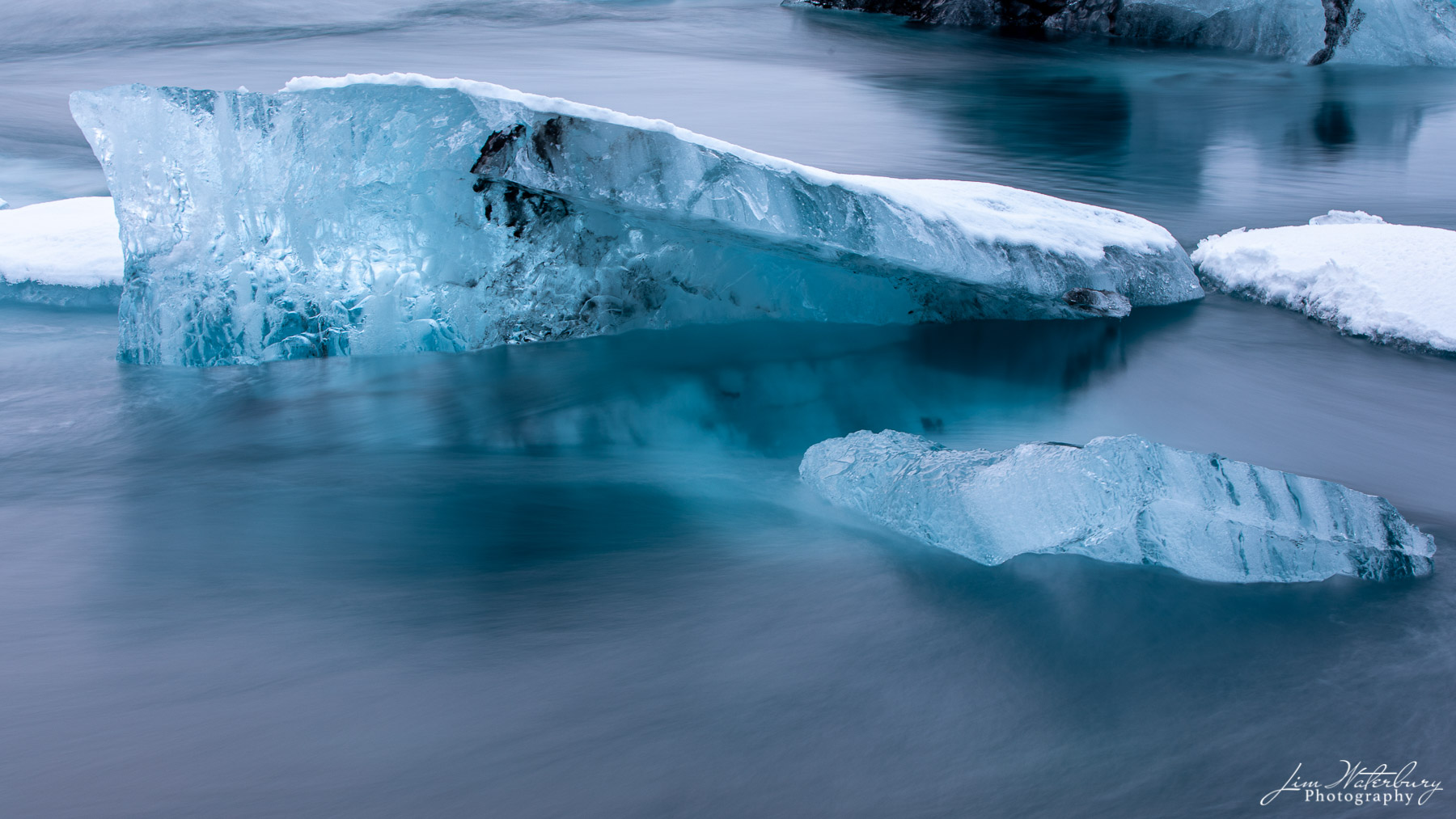 Ice sculpture reflected in the waters of the Jokulsarlon glacial lagoon, Iceland.