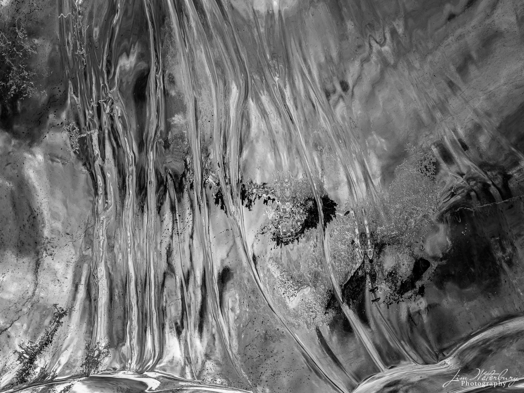 Ice Candy Black & white image of ribbons of ice on the wall of an Ice cave in Breidarmerkurjokull outlet glacier (Vatnajokull), Iceland...