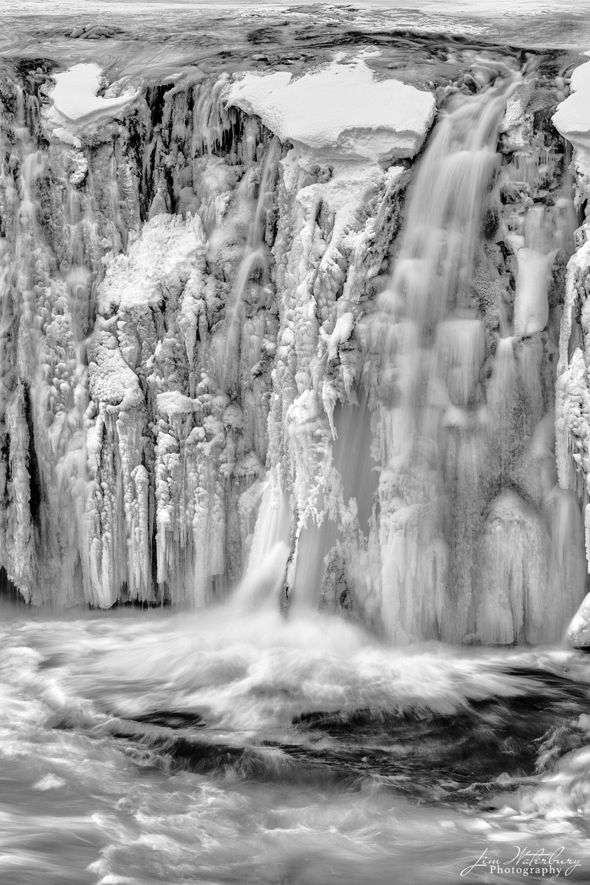 Frosting Black & white image of detail of the Godafoss waterfall ("Waterfall of the Gods") in Northern Iceland in winter.