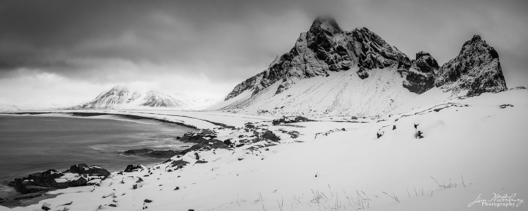 Isolation Panoramic black & white image of the view from the Hvalnes Nature Preserve on the east coast of Iceland, and Eystrahorn mountain...