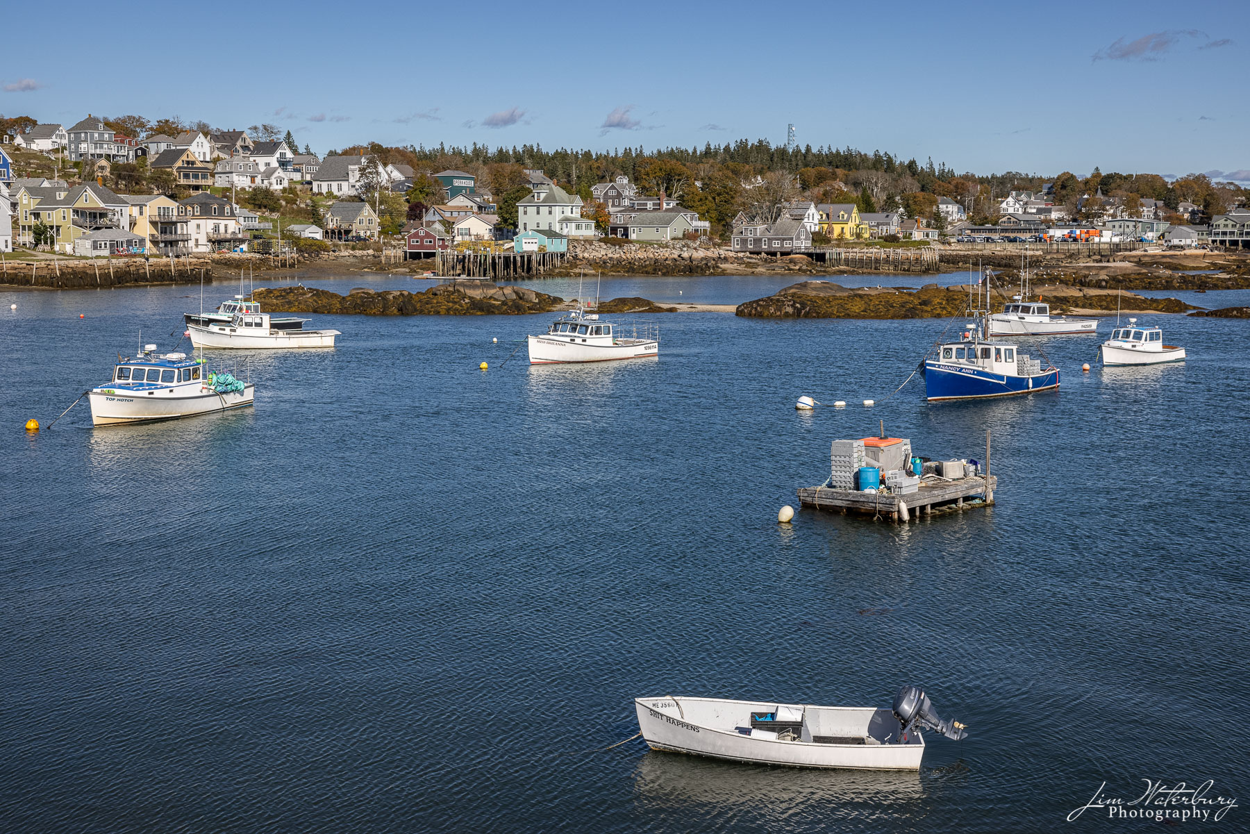 Boats and houses in the small harbor of Stonington, Maine.