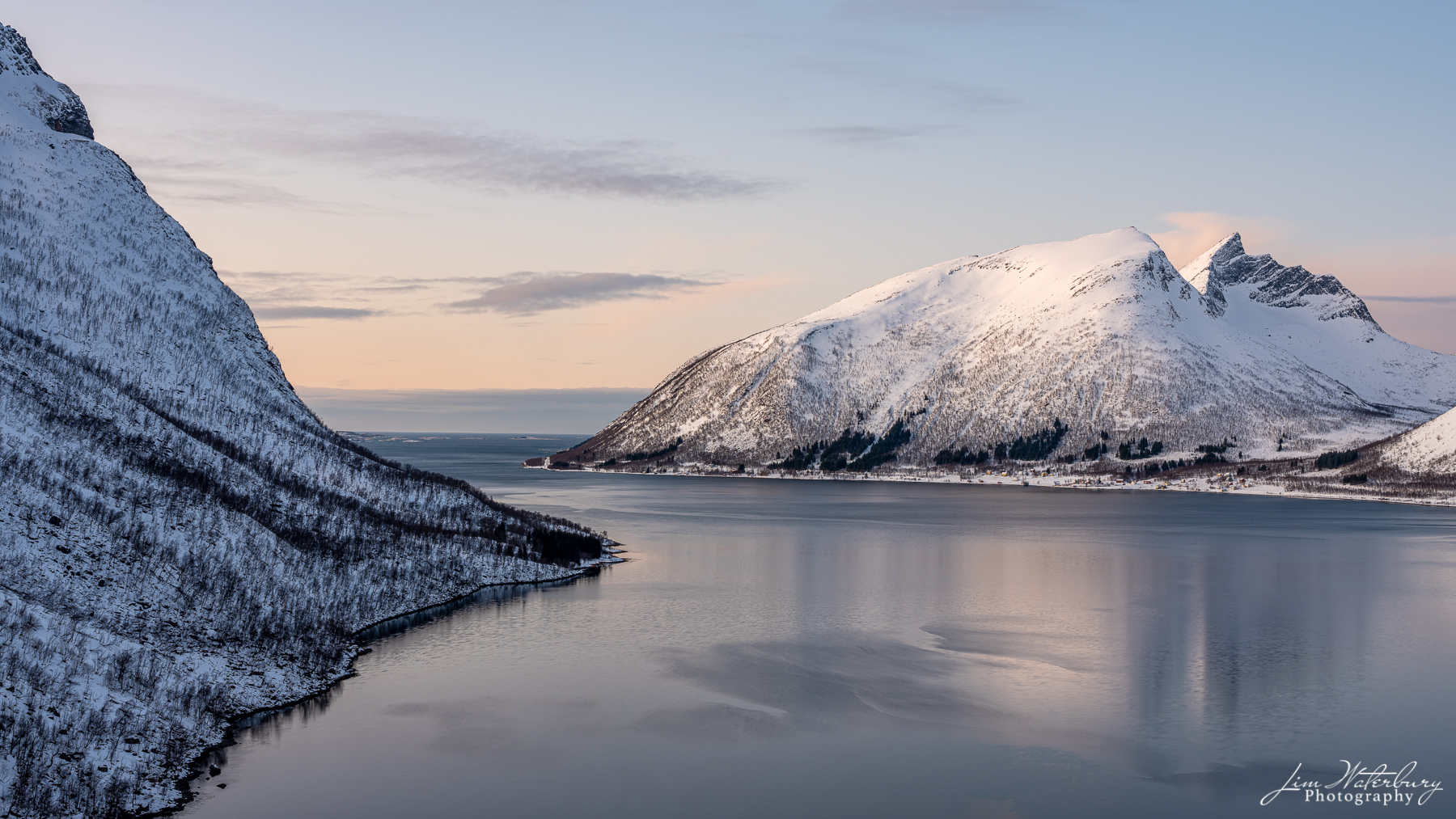 Evening Calm Soft evening light shines on the fjord at Bergsford, Senja, in the Lofoten Islands of Norway.