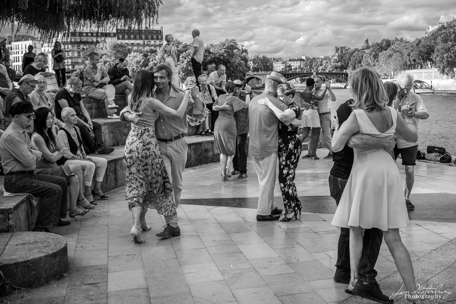 Dancing on the Quai Dancers practice their craft in the evening on the Quai Saint-Bernard, Paris. Black & white.