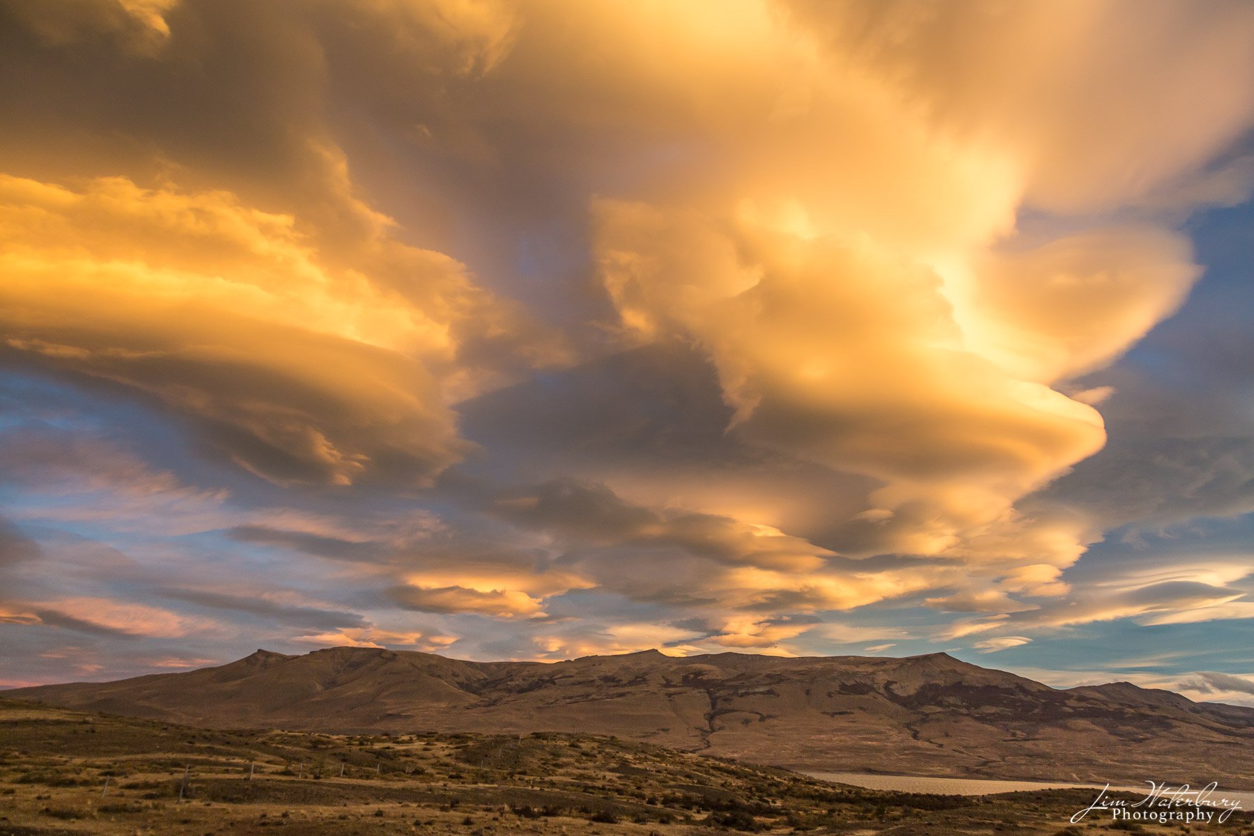 Heavenly Clouds #1 A series of lenticular clouds glow in the late afternoon sun in Torres del Paine National Park, Patagonia.