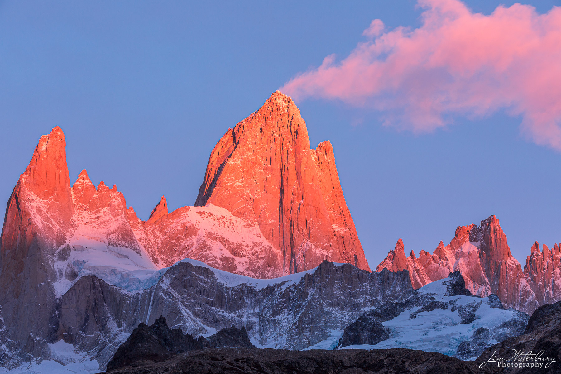 Pink Plume Alpenglow, as pink clouds, like a plume of smoke, rise above Mt. Fitz Roy. at sunrise, Parque Nacional los Glaciares, Argentina...