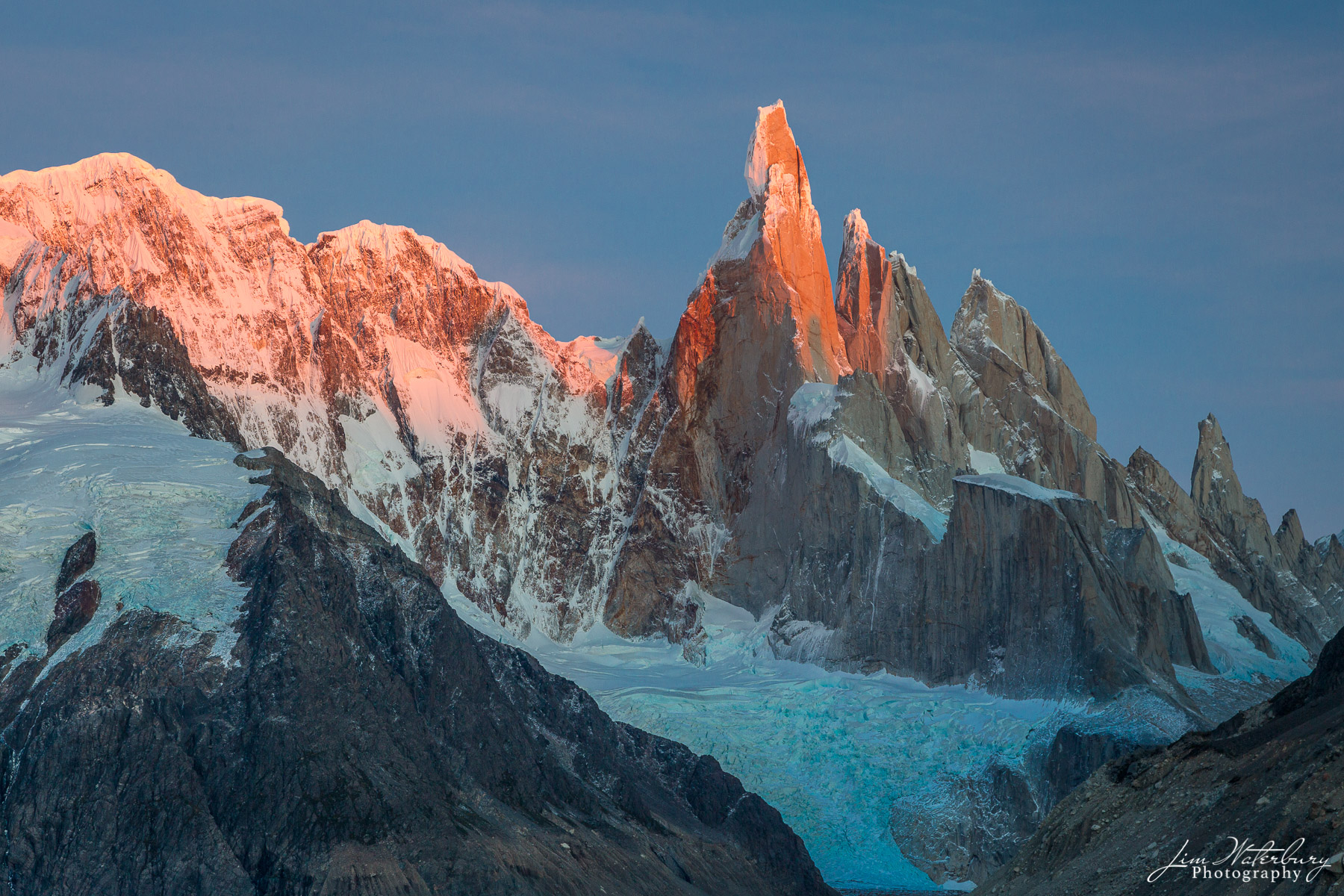 Sunrise over Cerro Torre Massif, Patagonia.  Cerro Torre itself is a 10,262-foot-high, sheer-walled granite tower on the border...