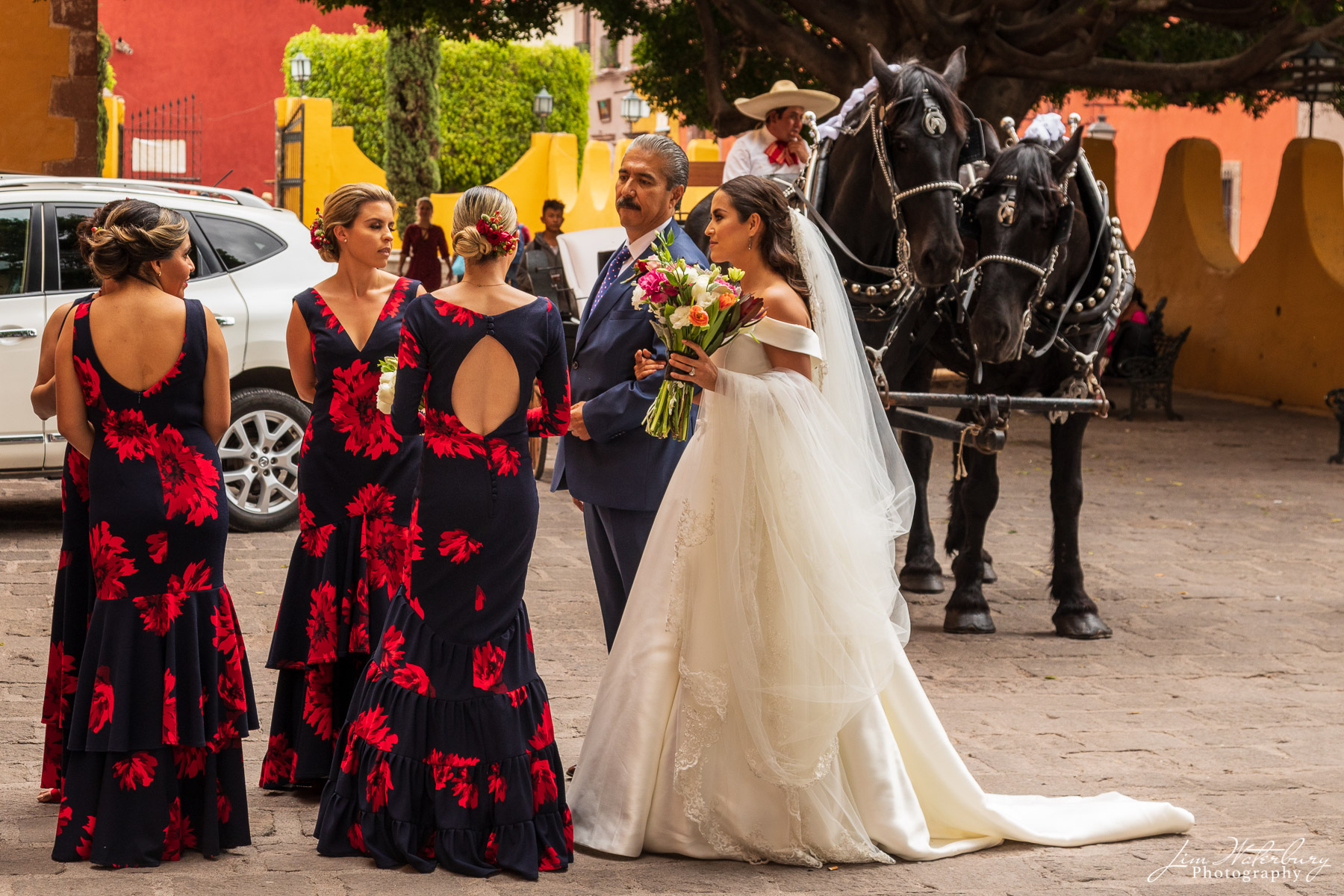 San Miguel Wedding The bride and her father talk with bridesmaids before wedding ceremony in San Miguel de Allende.
