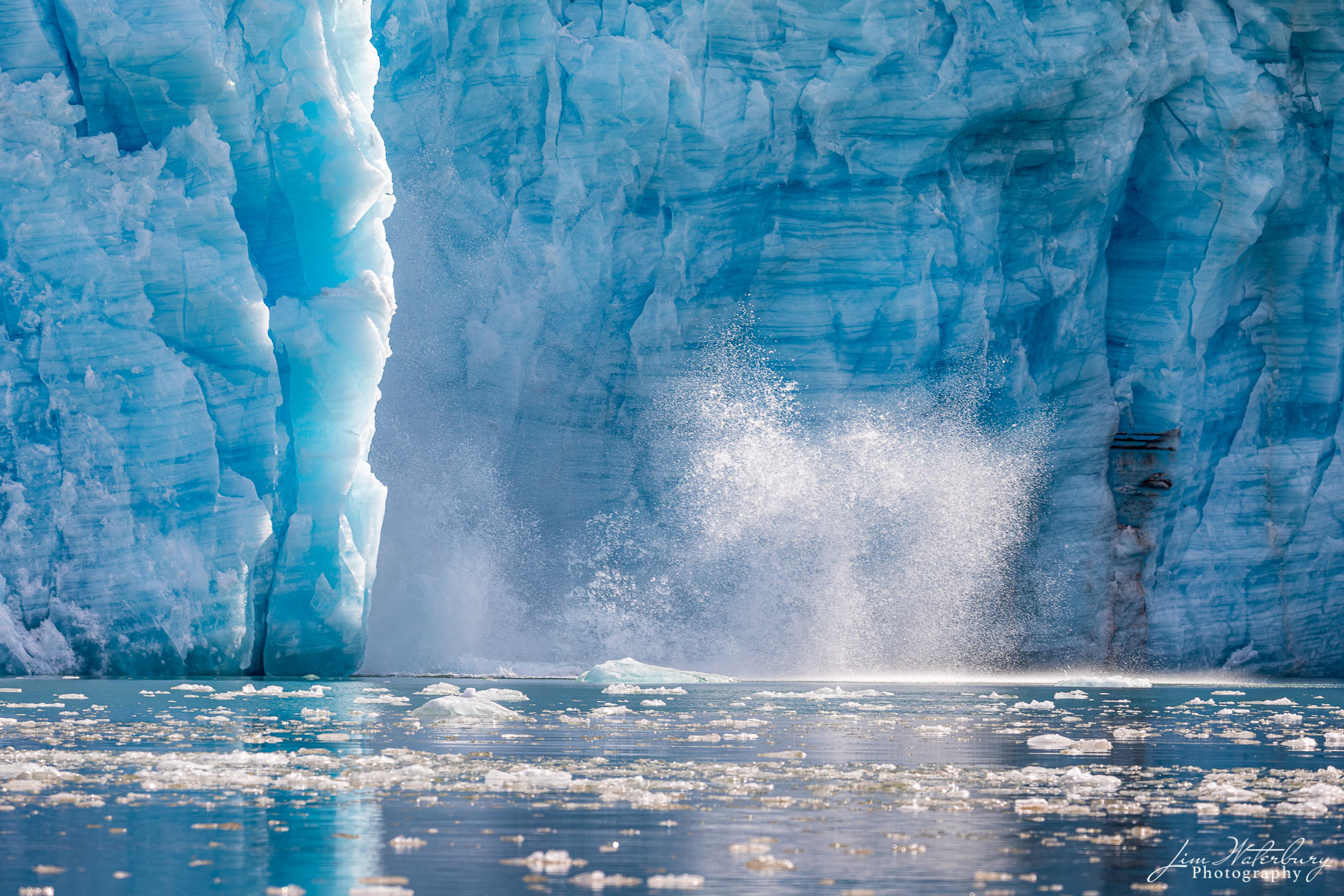 Ice calves from the Lilliehöökbreen glacier complex in Albert I Land and Haakon VII Land, in Svalbard.  The glacier itself...