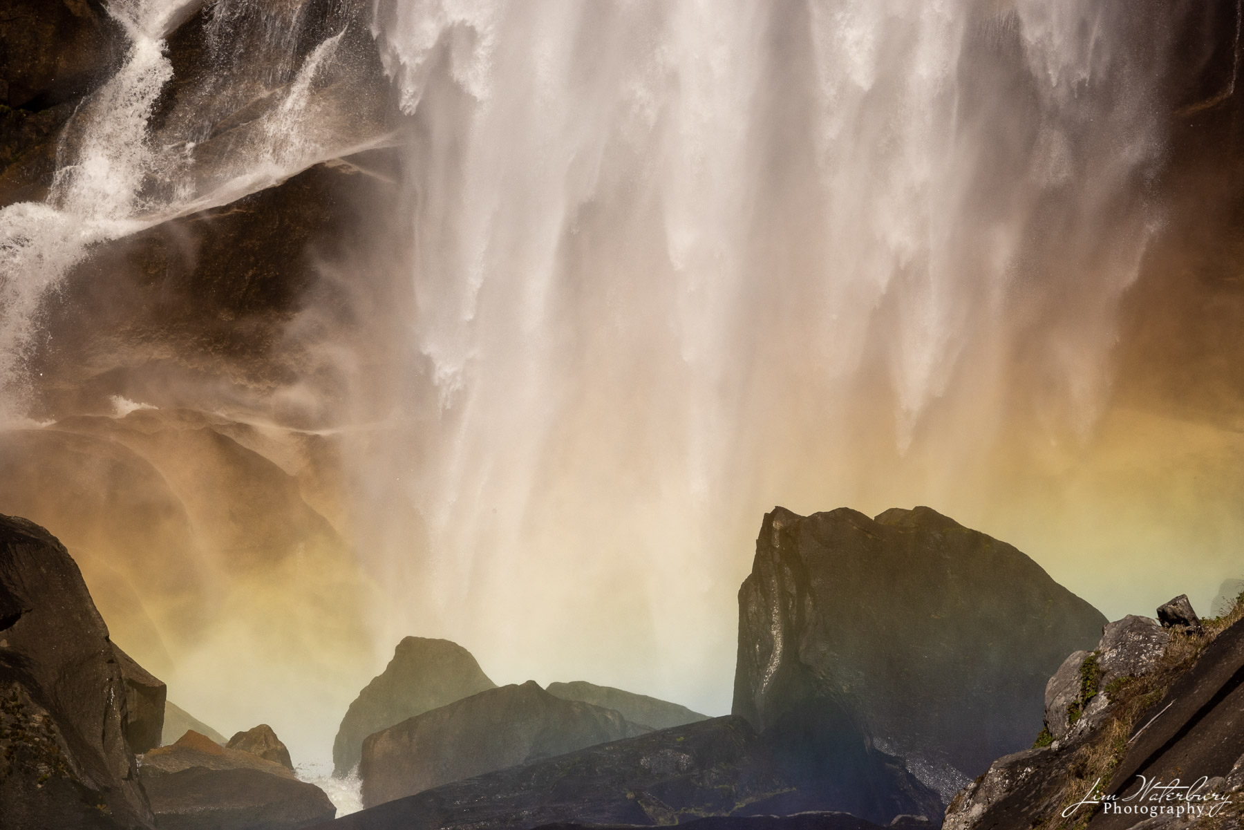 Detail of Vernal Falls, Yosemite Valley, photographed from a rock in the middle of the river, and showing a rainbow of colors...